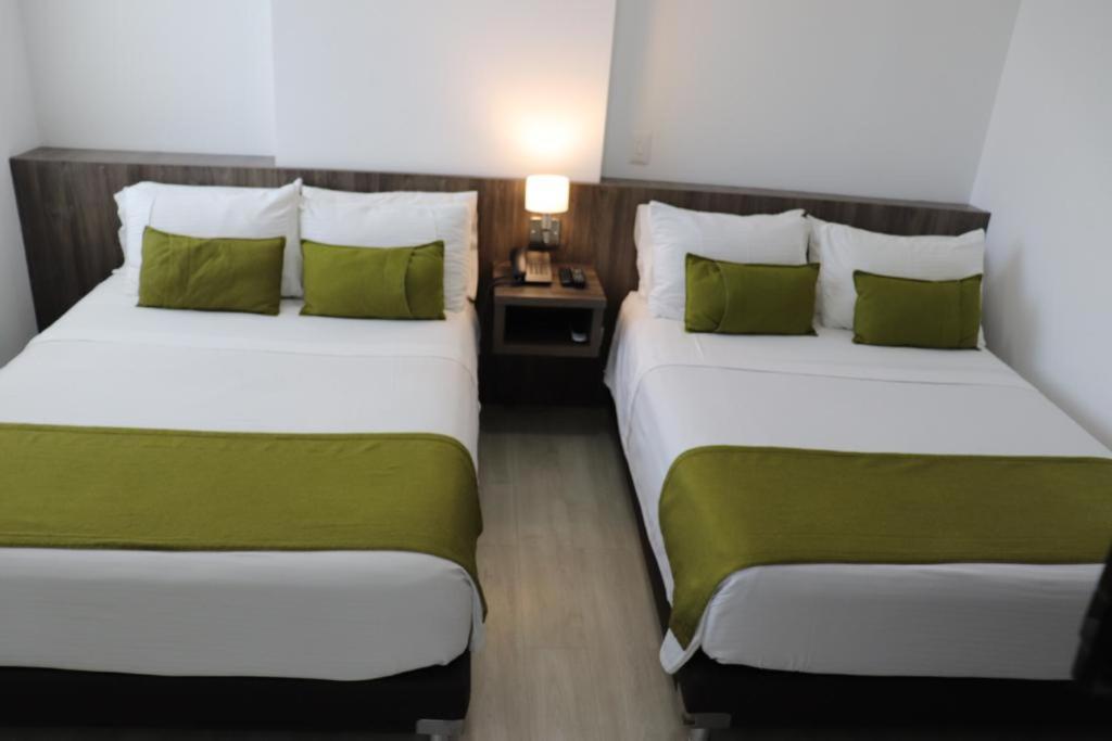 Postel nebo postele na pokoji v ubytování Hotel Santiago de Arma