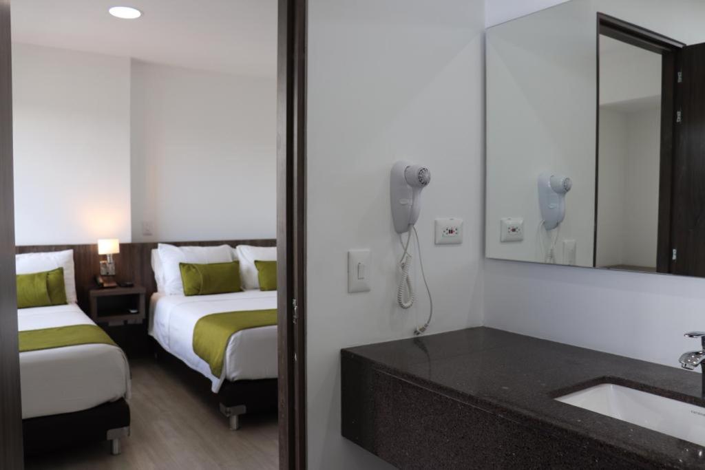 Postel nebo postele na pokoji v ubytování Hotel Santiago de Arma