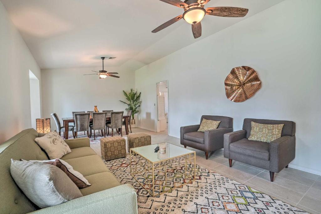 uma sala de estar com um sofá, cadeiras e uma mesa em Bermuda Dunes Home with Private Pool and Hot Tub! em Bermuda Dunes