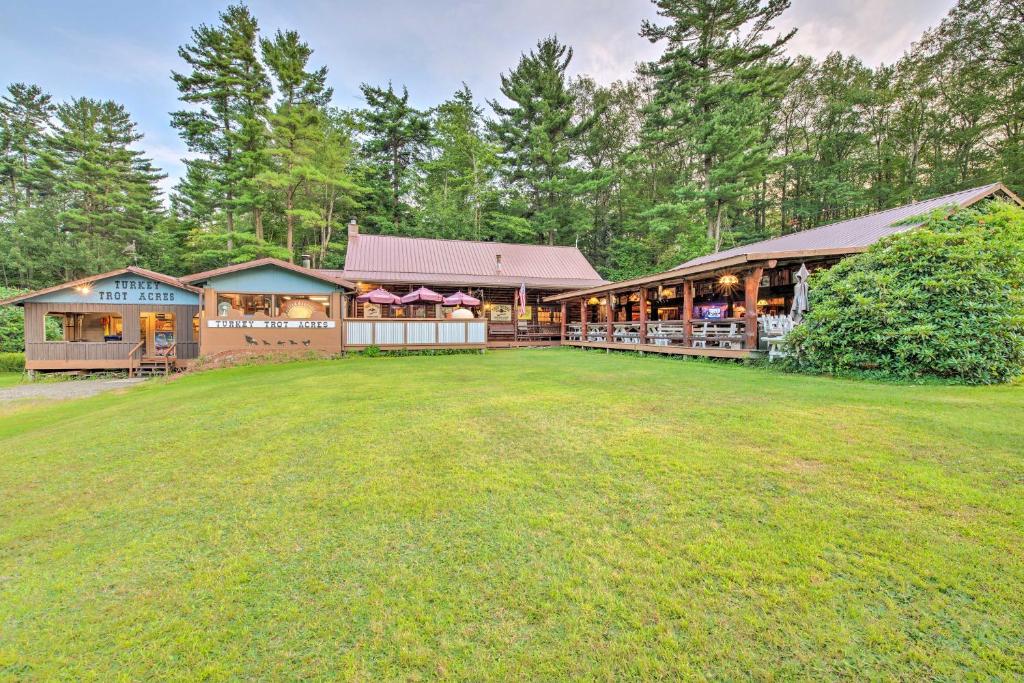 a large yard in front of a building at Handcrafted Log Cabin in Candor Group Getaway! in Candor