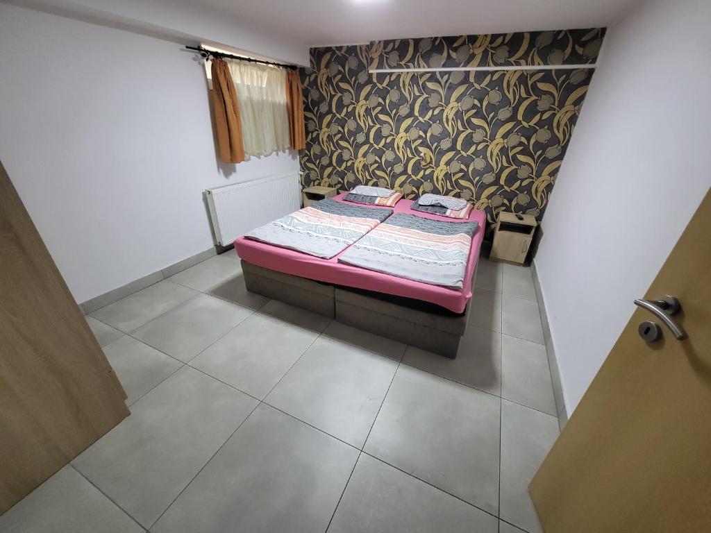 Postel nebo postele na pokoji v ubytování Anita Apartman Sopron