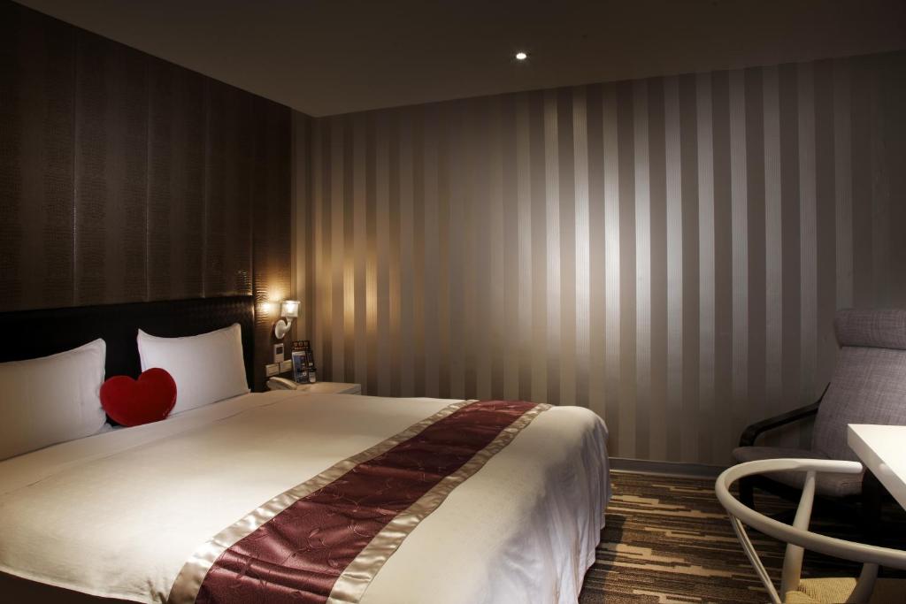 Postel nebo postele na pokoji v ubytování Grace Hotel