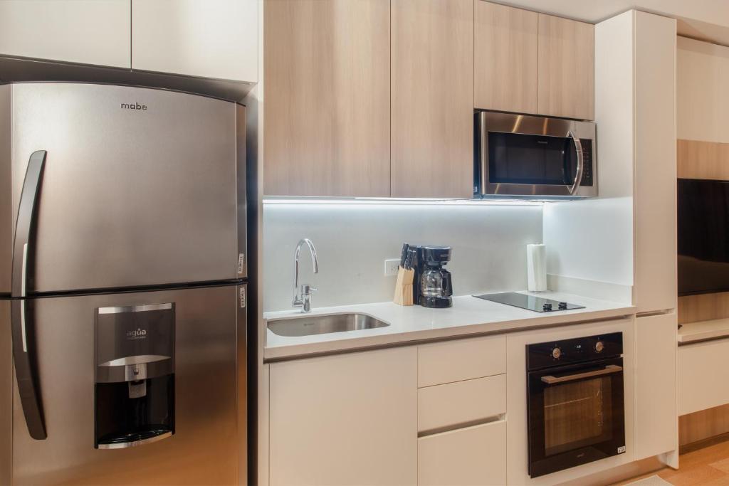 Kuchyň nebo kuchyňský kout v ubytování Residencias Cityzen cerca del Aeropuerto