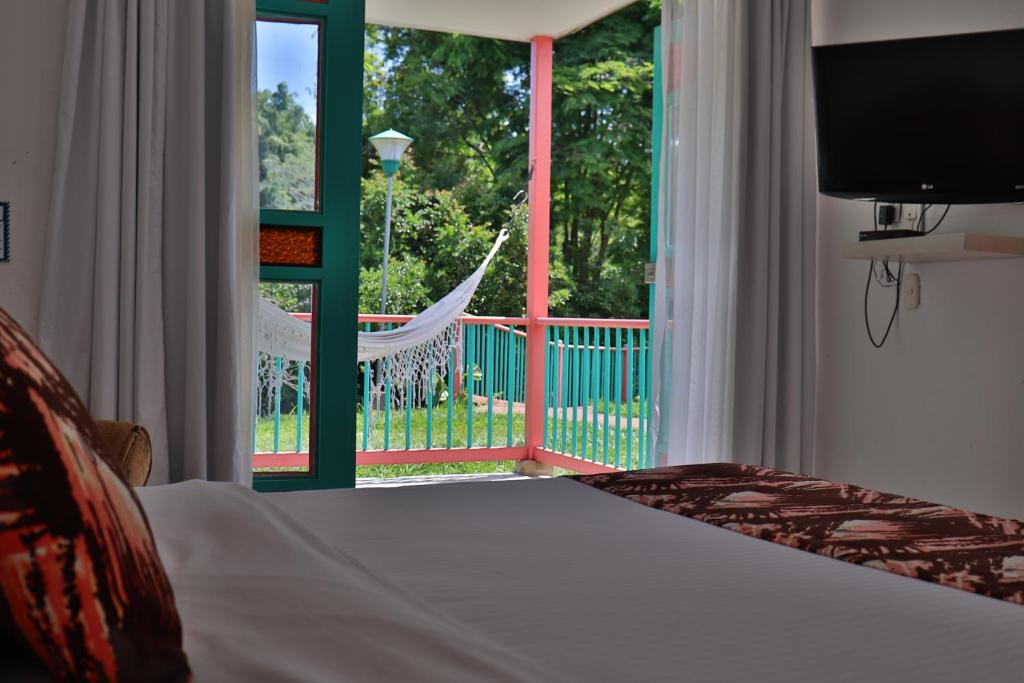 Postel nebo postele na pokoji v ubytování Hotel Campestre La Tata