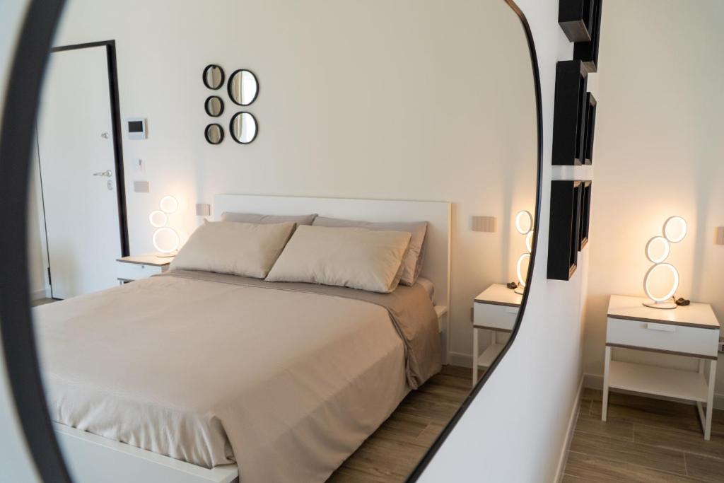 A bed or beds in a room at Blanco - MAGNIFICENT B&B Altamura