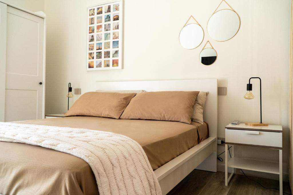A bed or beds in a room at Blanco - MAGNIFICENT B&B Altamura