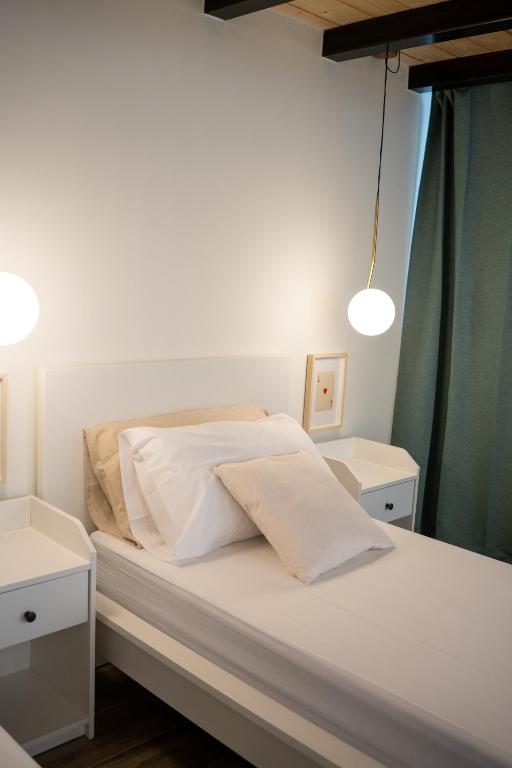 A bed or beds in a room at Blanco - MAGNIFICENT B&B Altamura
