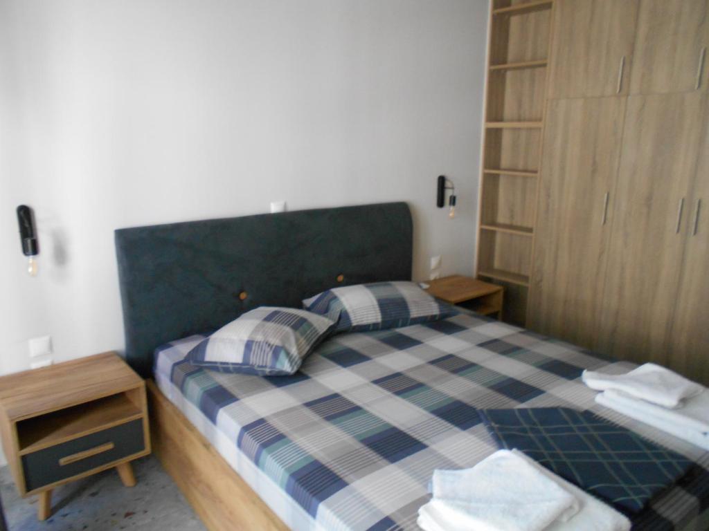 Postel nebo postele na pokoji v ubytování SPΛCES PYLOS Apartments