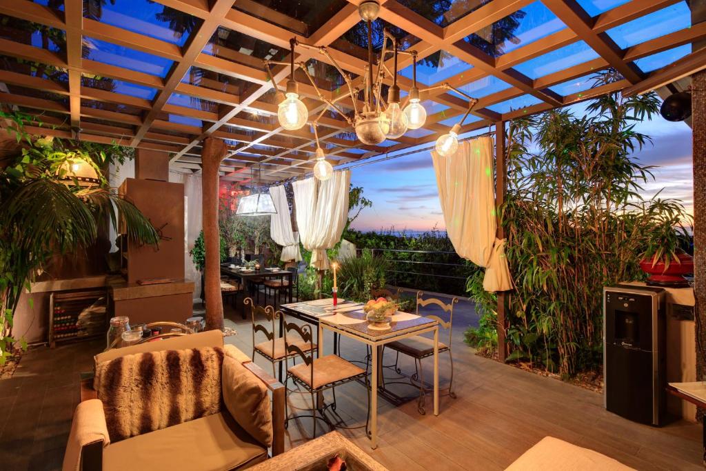 a patio with a table and chairs and plants at Marbella Boutique Art suites in Marbella