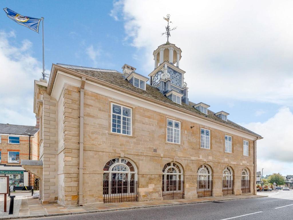 a building with a clock tower on top of it at The Loft At Brackley Town Hall in Brackley