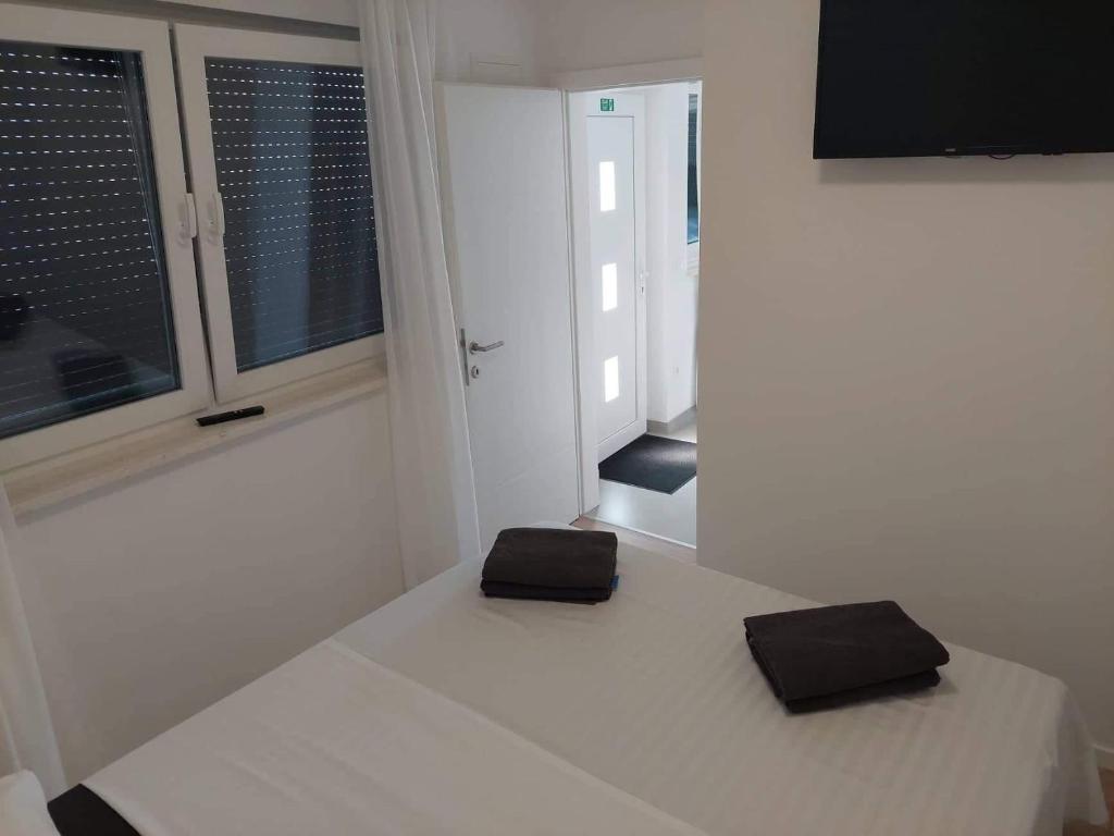 Posteľ alebo postele v izbe v ubytovaní Ferienhaus MAESTRAL - Kastel Kambelovac
