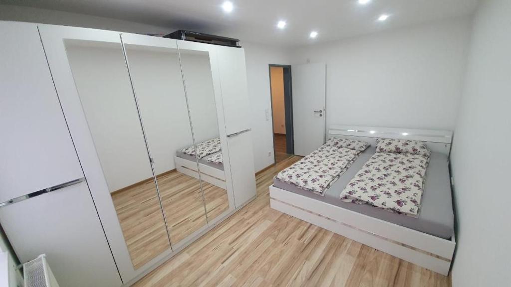 a bedroom with two beds and a walk in closet at La Rancu in Sportivilor in Topliţa