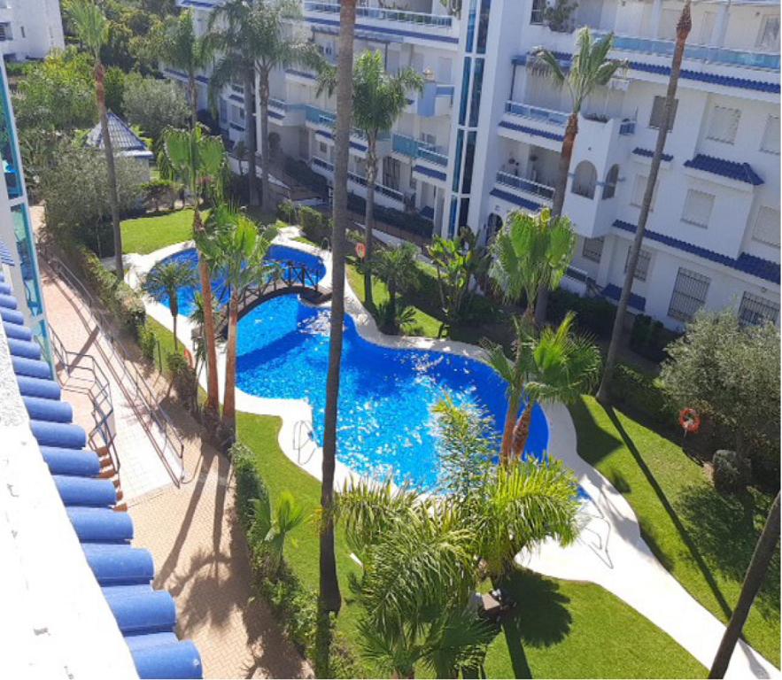 Bazén v ubytovaní Ático en Costa Ballena con Barbacoa, Aire Acondicionado y WIFI alebo v jeho blízkosti