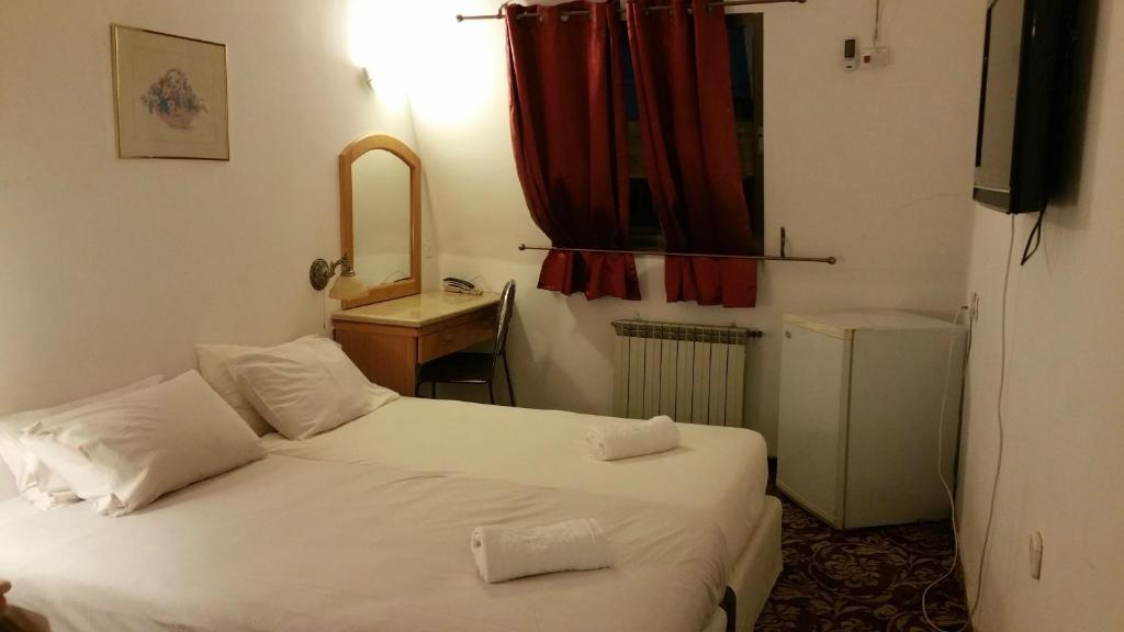 Postel nebo postele na pokoji v ubytování Zion Hotel