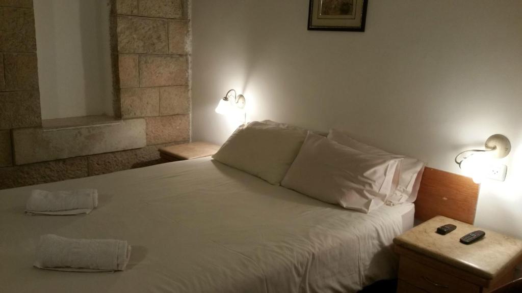Postel nebo postele na pokoji v ubytování Zion Hotel