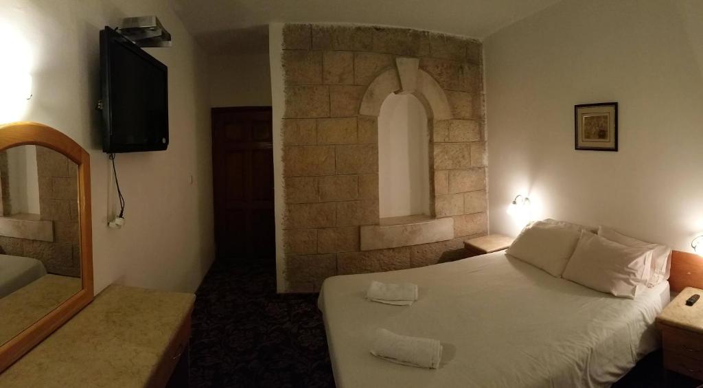 Postel nebo postele na pokoji v ubytování Zion Hotel
