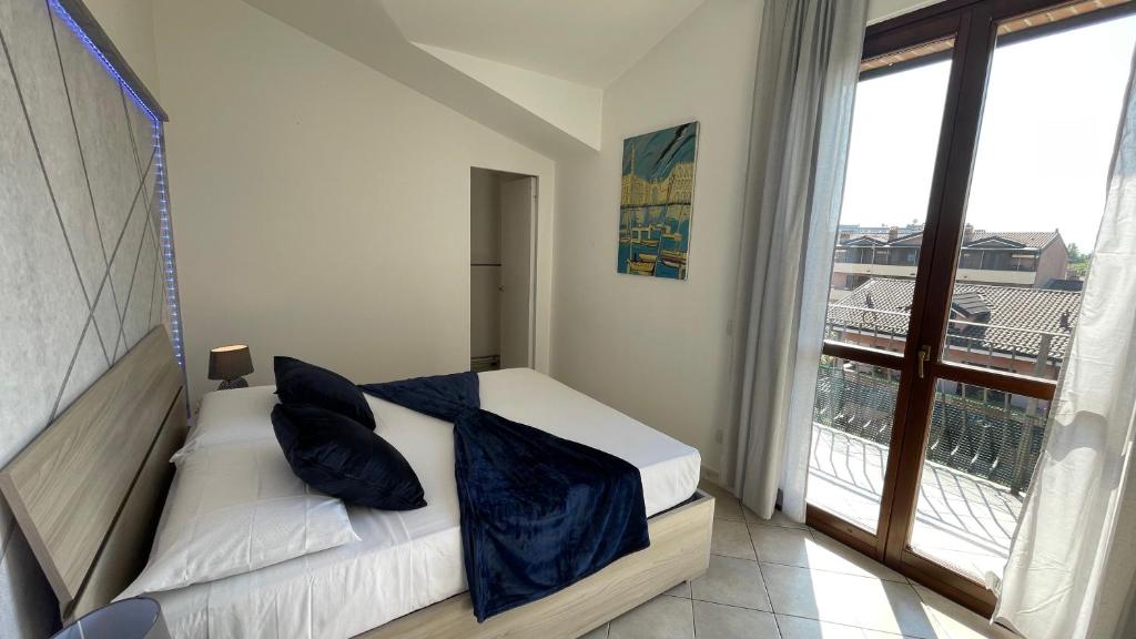 Postel nebo postele na pokoji v ubytování DeHomes - Relax & Business Apartments