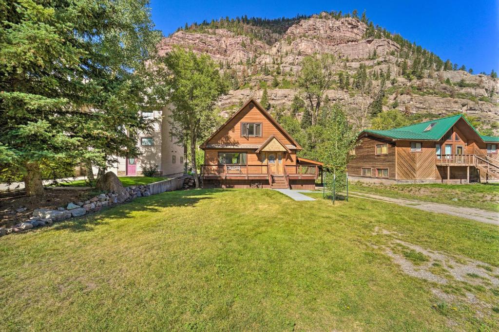 an image of a house with a mountain in the background at Updated Mtn Home with Deck on Uncompahgre River in Ouray