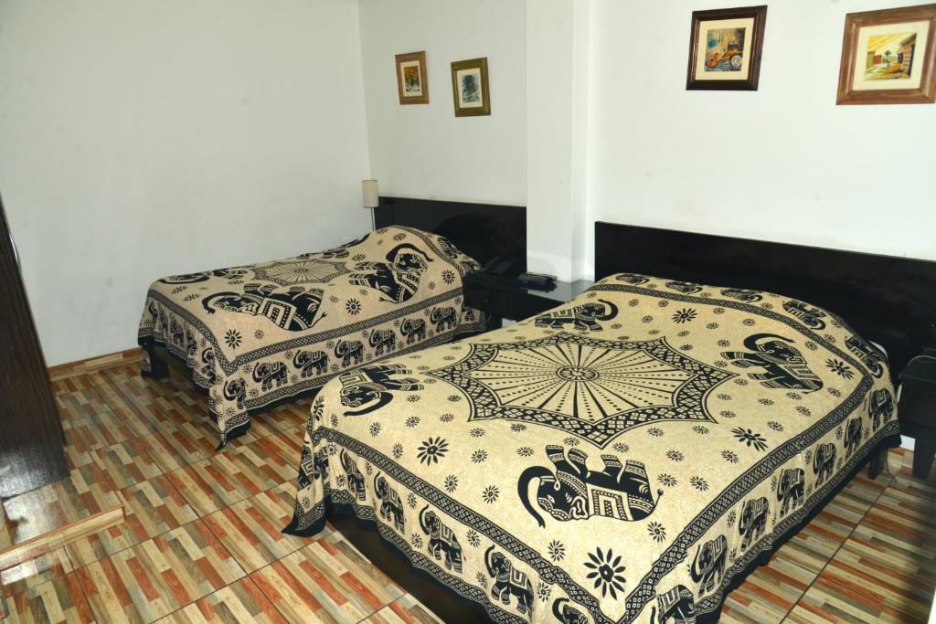 Postel nebo postele na pokoji v ubytování Residencial Carlos