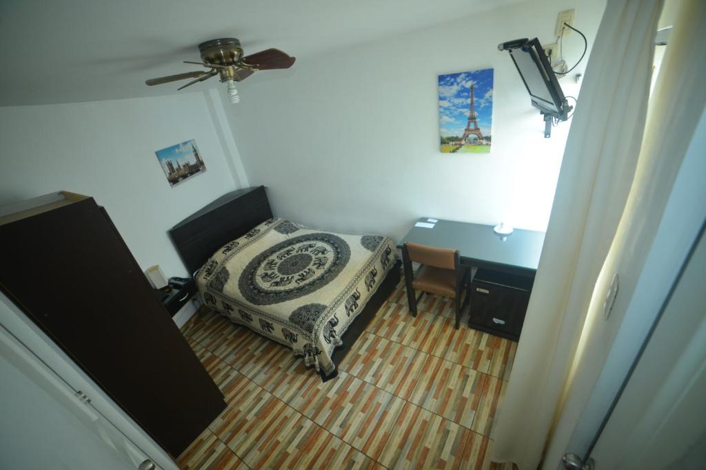 Postel nebo postele na pokoji v ubytování Residencial Carlos