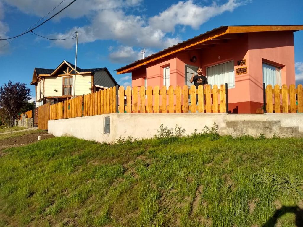 a house with a wooden fence in front of it at Buena Vista Trevelin II in Trevelin