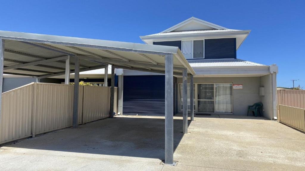 a covered parking lot in front of a house at Unit 54 Seafront Estate in Jurien Bay