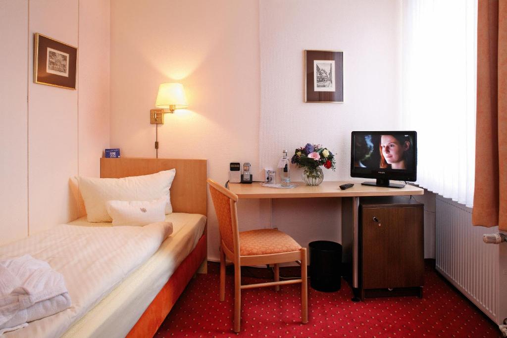 TV a/nebo společenská místnost v ubytování Hotel Benn