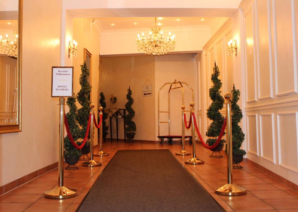 a hallway with christmas trees and garlands on display at Hotel Dalberg in Aschaffenburg