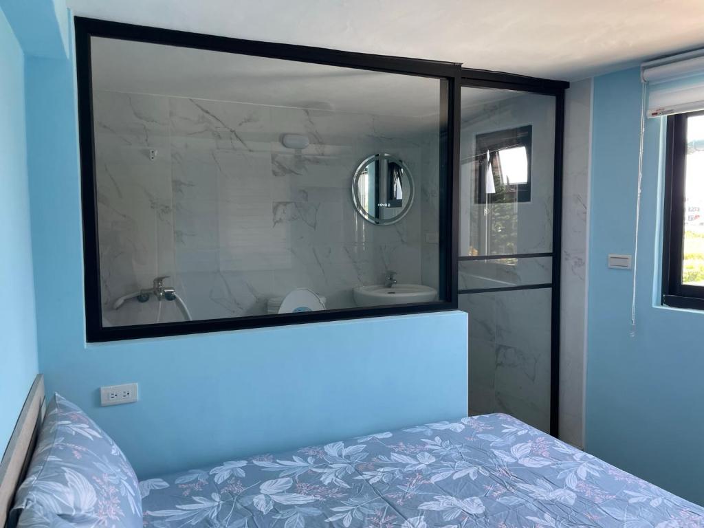 Postel nebo postele na pokoji v ubytování Wen Wen Sub BnB