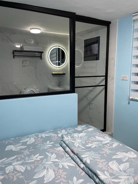 Postel nebo postele na pokoji v ubytování Wen Wen Sub BnB