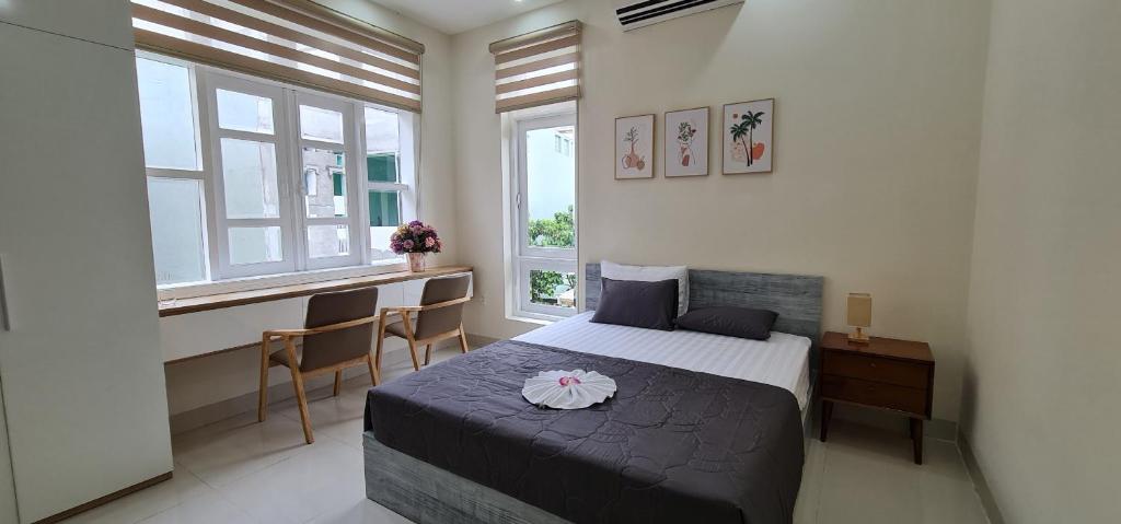 Ένα ή περισσότερα κρεβάτια σε δωμάτιο στο Châu Gia Villa Vũng Tàu - Có chỗ đậu xe hơi
