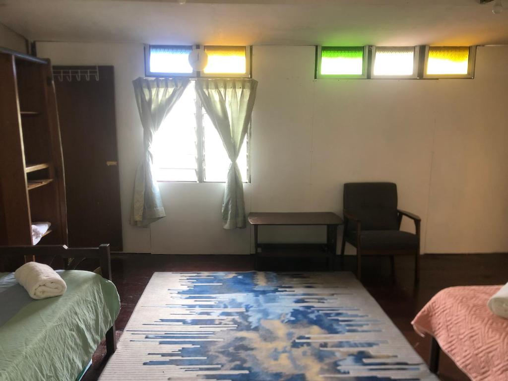 Postel nebo postele na pokoji v ubytování MyDusun Chalet, Taiping, Perak, Malaysia