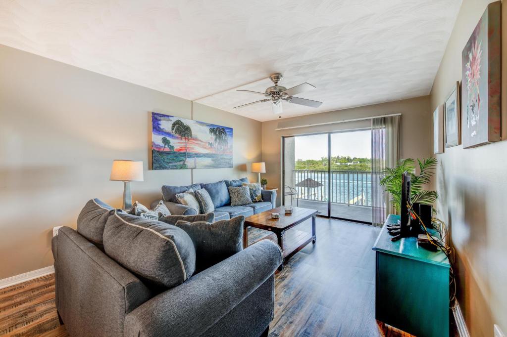 a living room with a couch and a table at Bayshore Yacht & Tennis 216 in Clearwater Beach