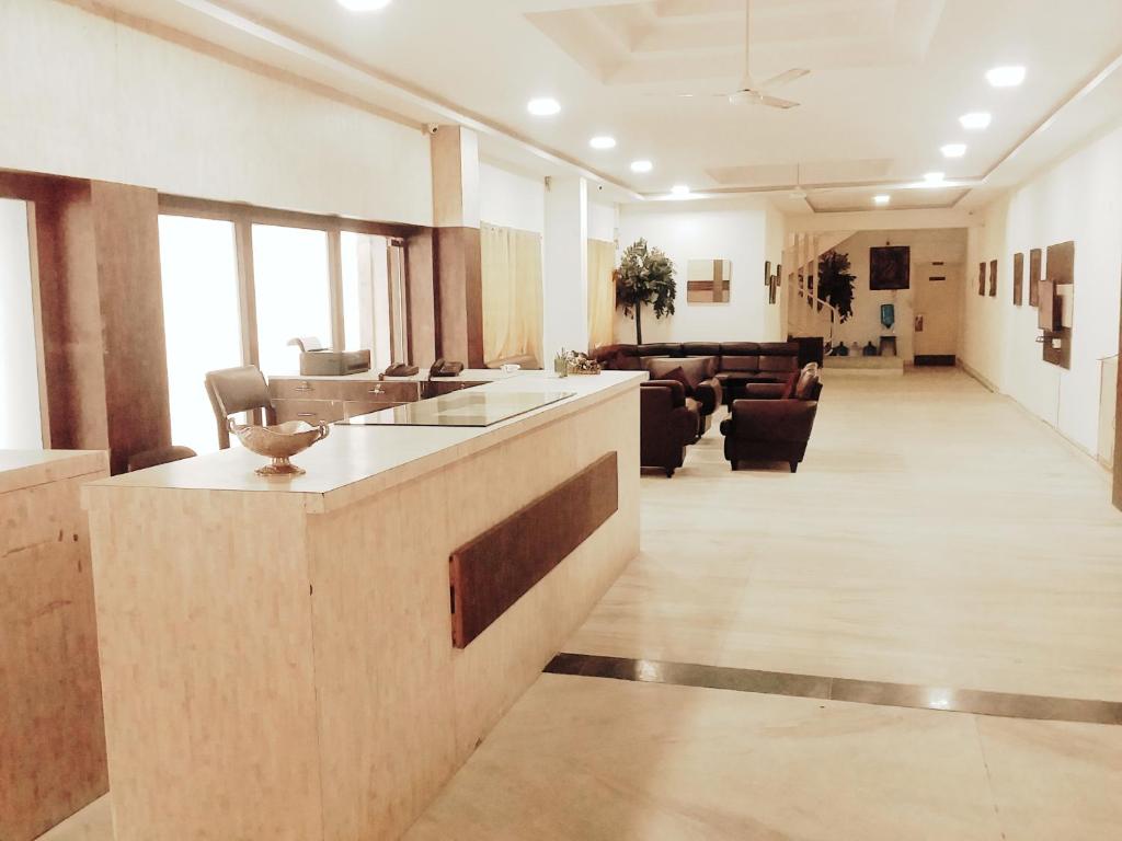 a large room with a kitchen and a living room at Hotel Ranjit Residency in Hyderabad