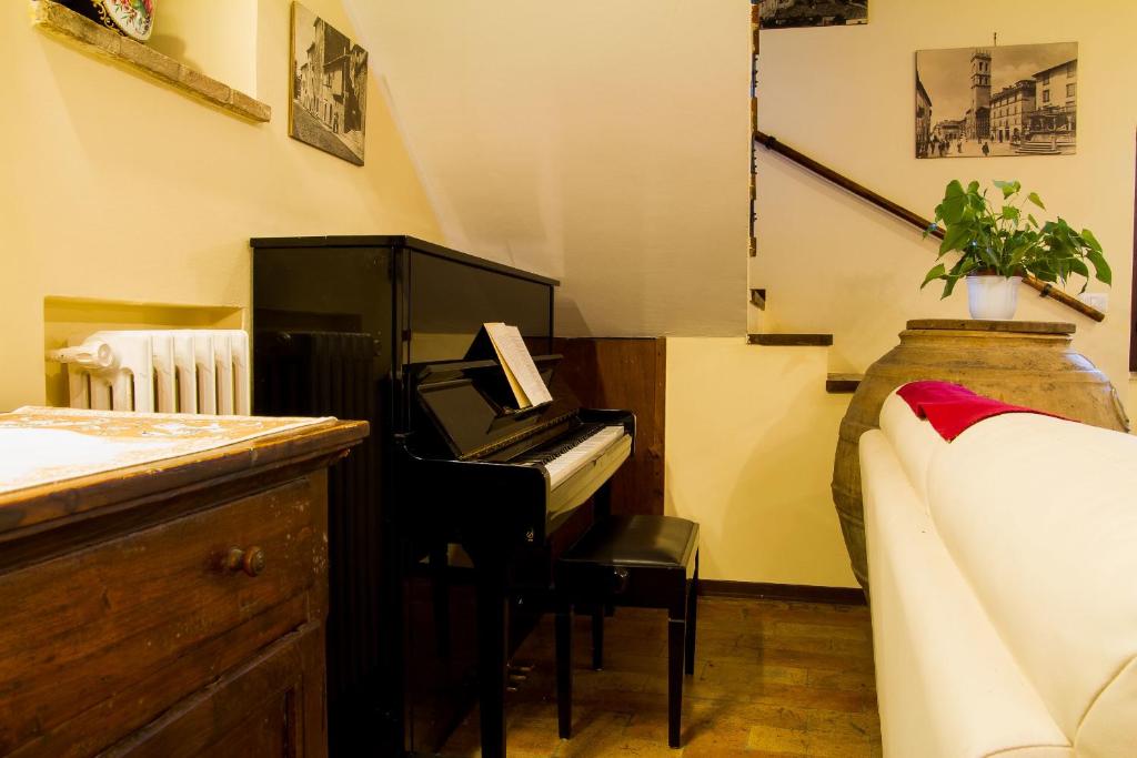 Postel nebo postele na pokoji v ubytování All'Ombra di San Damiano