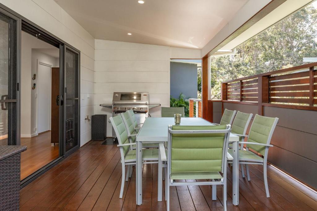 a kitchen and dining room with a table and chairs at Seaclusion in Elizabeth Beach