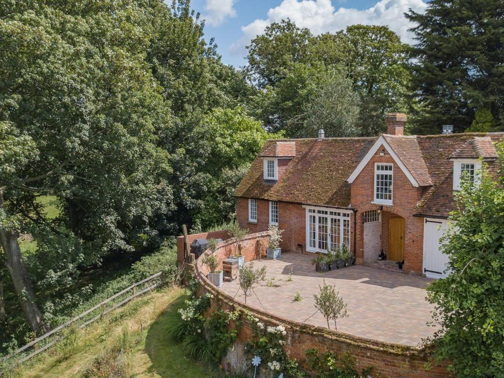 an aerial view of a brick house with a driveway at The Coach House Stables in Graveney