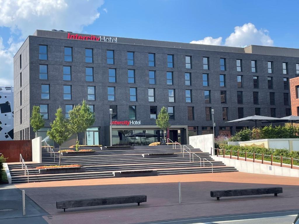 a large building with stairs in front of it at IntercityHotel Herford in Herford