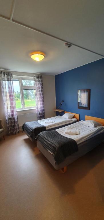Postel nebo postele na pokoji v ubytování Nipanhotellet