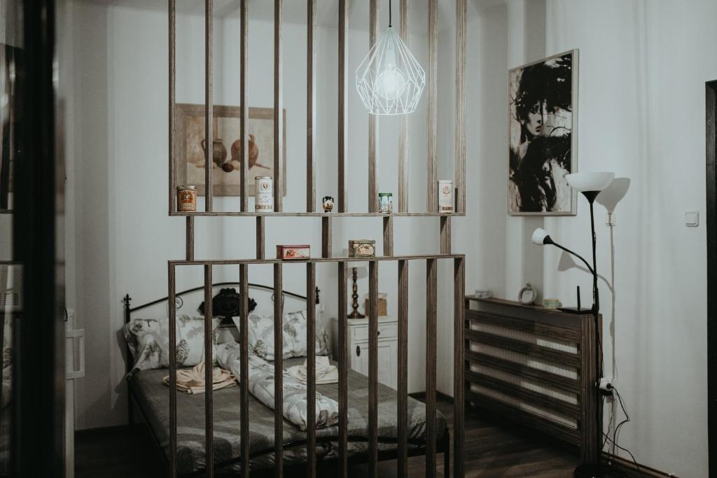 a bedroom with a metal bed in a room at Urbino Casa in Cluj-Napoca