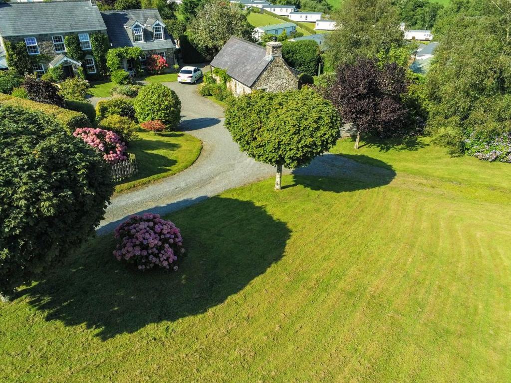 an aerial view of a yard with a tree and a driveway at Summerhill Cottage HW7101 in Amroth