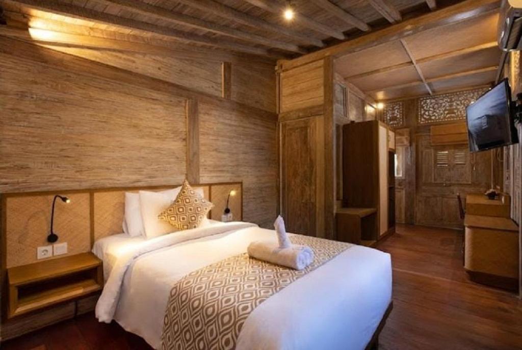 Postel nebo postele na pokoji v ubytování Saba Villa by Sanga Sanga Hospitality