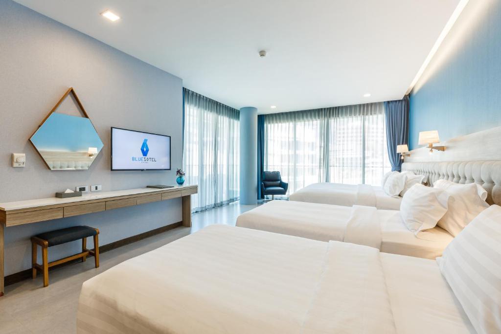 Postel nebo postele na pokoji v ubytování BlueSotel Krabi AoNang Beach