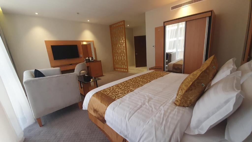 Letto o letti in una camera di Al Rayyan Tower