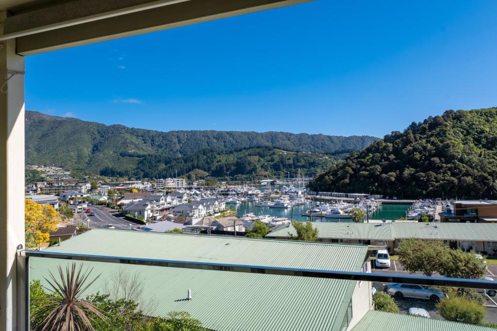 a view of the city from the balcony of a house at Peaceful Escape - Picton Holiday Apartment in Picton