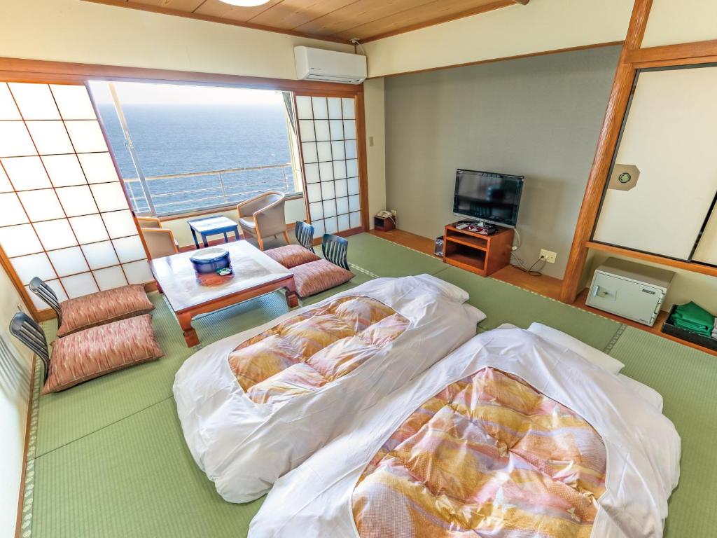 TV a/nebo společenská místnost v ubytování Atagawa Onsen Blue Ocean