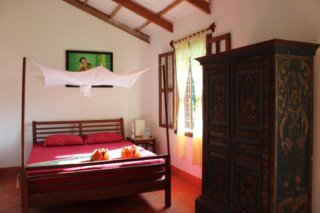 Postel nebo postele na pokoji v ubytování Arun Mekong Guesthouse