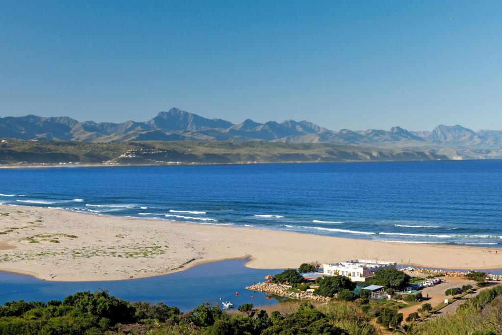 an aerial view of a beach and the ocean at Milkwood Manor on Sea in Plettenberg Bay