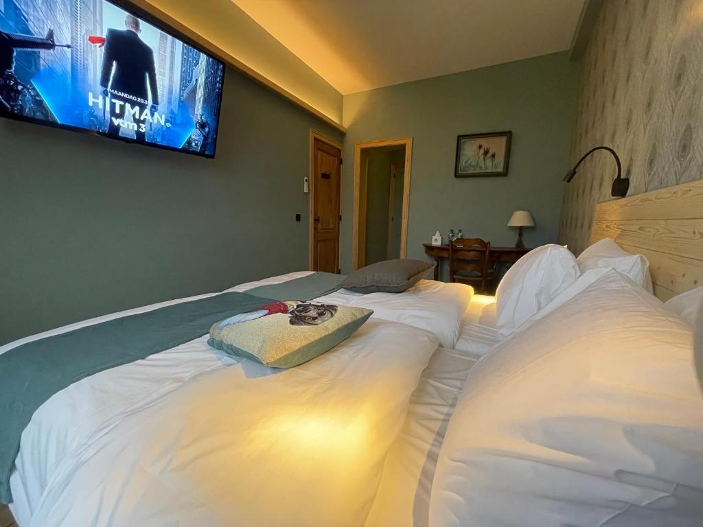 Postel nebo postele na pokoji v ubytování Hôtel Maison Demelenne