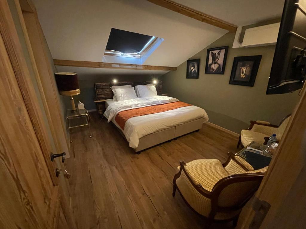 Postel nebo postele na pokoji v ubytování Hôtel Maison Demelenne